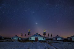 The Mongolian Yurts In Night Starry Sky In Winter Stock Photos