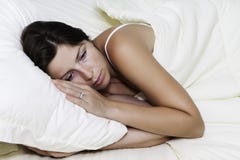 The Sad Beautiful Young Lying Woman Royalty Free Stock Photography The Sad Beautiful Young Lying Woman Royalty Free Stock Photography