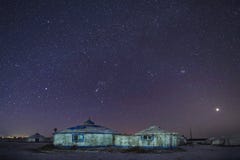 The White Mongolian Yurts In Night Starry Sky In Winter Royalty Free Stock Images