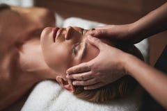 Therapist make anti age forehead wrinkles massage royalty free stock image Therapist make anti age forehead wrinkles massage royalty free stock image