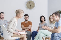 Therapist talking to man stock photo Therapist talking to man stock photo
