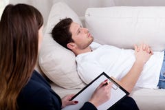 Therapist working with patient on hypnosis