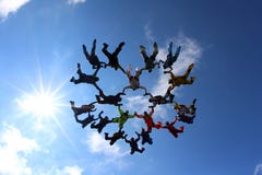 Skydivers are flying together in the blue sky. royalty free stock image Skydivers are flying together in the blue sky. royalty free stock image