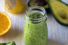 Thick nutritious smoothies, which include: avocado, apple, banana, spinach, orange juice, honey, flax seeds, mint and olive oil. royalty free stock photo Thick nutritious smoothies, which include: avocado, apple, banana, spinach, orange juice, honey, flax seeds, mint and olive oil. royalty free stock photo