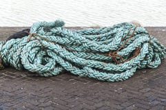 Thick rope cables lying on the street stock photo Thick rope cables lying on the street stock photo