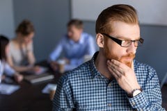 Thoughtful businessman looking away holding hand on chin plannin stock photography Thoughtful businessman looking away holding hand on chin plannin stock photography