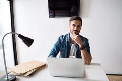 Thoughtful man working in office royalty free stock photography Thoughtful man working in office royalty free stock photography