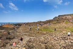 Thousands of tourists visiting Giant`s Causeway in County Antrim of Northern Ireland stock photo Thousands of tourists visiting Giant`s Causeway in County Antrim of Northern Ireland stock photo