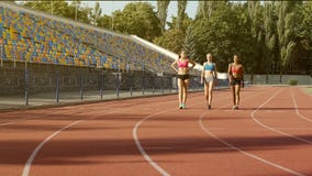 Three beautiful multiracial girls from national team coming to sports training stock images Three beautiful multiracial girls from national team coming to sports training stock images