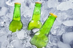 Three bottles of beer on ice stock image Three bottles of beer on ice stock image