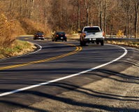 Three Cars On A Curvy Road Royalty Free Stock Image Three Cars On A Curvy Road Royalty Free Stock Image