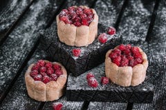 Three charlotte cakes with raspberry Stock Image Three charlotte cakes with raspberry Stock Image
