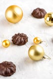 Three dark chocolate-coated zefir top view isolated on white background airy with christmas ornaments stock image Three dark chocolate-coated zefir top view isolated on white background airy with christmas ornaments stock image