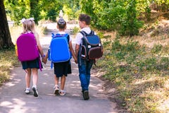 Three Elementary School Students With Backpacks Royalty Free Stock Photos