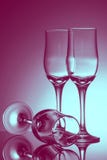 Three empty champagne glasses on colored background stock images Three empty champagne glasses on colored background stock images