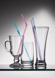 Three empty glasses with colored tubes for cocktail. stock photos Three empty glasses with colored tubes for cocktail. stock photos