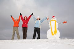 Three girls with snowman royalty free stock images Three girls with snowman royalty free stock images