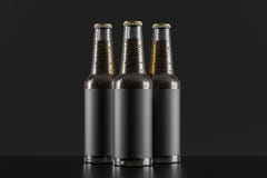 Three glass bottles over black background royalty free stock photography Three glass bottles over black background royalty free stock photography