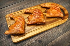 Three Grilled BBQ Chicken Leg Quarter On Wood Board stock photo Three Grilled BBQ Chicken Leg Quarter On Wood Board stock photo