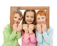 Three happy smiling kids looking picture frame