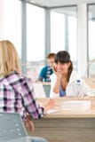 Three high school students in classroom stock image Three high school students in classroom stock image