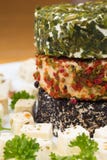 Three round cheese with herbs on a plate Royalty Free Stock Photos Three round cheese with herbs on a plate Royalty Free Stock Photos