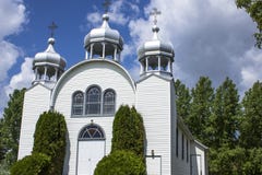 Three steeples on a small rural country white church. Stock Photo Three steeples on a small rural country white church. Stock Photo
