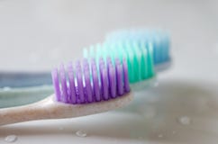 Three toothbrushes of different colors on white background stock photography Three toothbrushes of different colors on white background stock photography