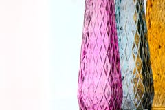 Three vases of colored glass with a pattern stock photography Three vases of colored glass with a pattern stock photography