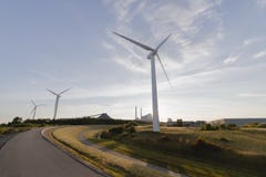 Three windmills curved path, summer sky day time royalty free stock photos Three windmills curved path, summer sky day time royalty free stock photos