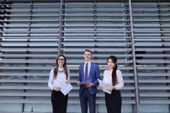 Three young entrepreneur modern, educated students, guy and two stock image Three young entrepreneur modern, educated students, guy and two stock image