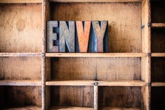 Thème en bois d'impression typographique de concept d'envie photos stock Thème en bois d'impression typographique de concept d'envie photos stock
