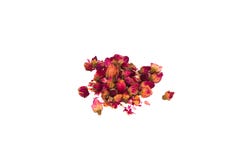 Thé des pétales et des boutons de rose dispersés sur la table dans un groupe photo libre de droits Thé des pétales et des boutons de rose dispersés sur la table dans un groupe photo libre de droits