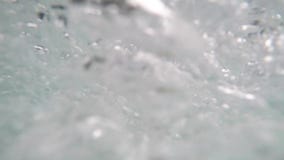 Tide of underwater bubbles in the hydromassage spa pool for health and pleasure. No people in. Underwater view stock footage Tide of underwater bubbles in the hydromassage spa pool for health and pleasure. No people in. Underwater view stock footage