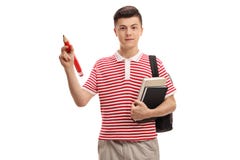 Tienerstudent die een potlood en boeken houden Royalty-vrije Stock Afbeeldingen Tienerstudent die een potlood en boeken houden Royalty-vrije Stock Afbeeldingen