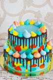 2-tiered homemade children`s cake decorated with colorful daub with meringue on white background royalty free stock photography 2-tiered homemade children`s cake decorated with colorful daub with meringue on white background royalty free stock photography