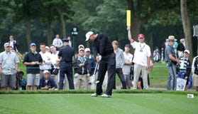 Tiger Woods Tees Off