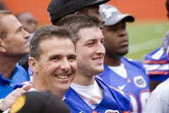 Tim Tebow and Urban Meyer share a smile