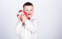 Time management. Morning. little boy with alarm clock. Time to relax. Party time. Businessman. Formal wear. tuxedo kid royalty free stock image Time management. Morning. little boy with alarm clock. Time to relax. Party time. Businessman. Formal wear. tuxedo kid royalty free stock image