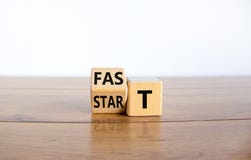 Time to fast start symbol. Turned a wooden cube with words `fast start`. Beautiful wooden table, white background, copy space.