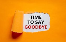 Time to say goodbye. The text `time to say goodbye` appearing behind torn orange paper. Business concept. Copy space