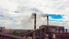 Hyperlapse. Urban landscape smoked polluted atmosphere from emissions of plants and factories, view of pipes with smoke. stock footage Hyperlapse. Urban landscape smoked polluted atmosphere from emissions of plants and factories, view of pipes with smoke. stock footage