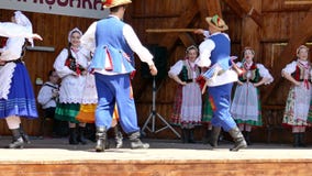 Dancers from Poland in traditional costume perform at one folk festival