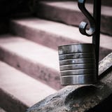 A tin can with out of focus stairs leading up to the can stock photos A tin can with out of focus stairs leading up to the can stock photos