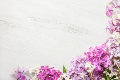 Tiny Flowers Of Lilac On An Old Wooden Background. Floral Border Stock Photography