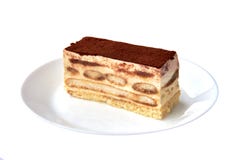 Tiramisu cake/ traditional italian dessert with cacao on a porcelain plate on the white background. Close up. royalty free stock photo Tiramisu cake/ traditional italian dessert with cacao on a porcelain plate on the white background. Close up. royalty free stock photo