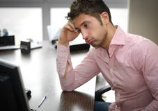 Tired or frustrated office worker looking at computer screen royalty free stock photo Tired or frustrated office worker looking at computer screen royalty free stock photo