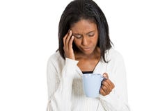 Tired sad woman looking at cup of coffee isolated Stock Photos Tired sad woman looking at cup of coffee isolated Stock Photos