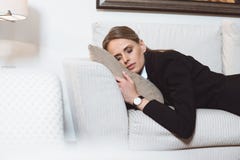 tired young businesswoman sleeping on sofa royalty free stock image tired young businesswoman sleeping on sofa royalty free stock image