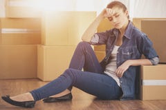 Tired Young Woman Sitting on the Floor. royalty free stock photo Tired Young Woman Sitting on the Floor. royalty free stock photo